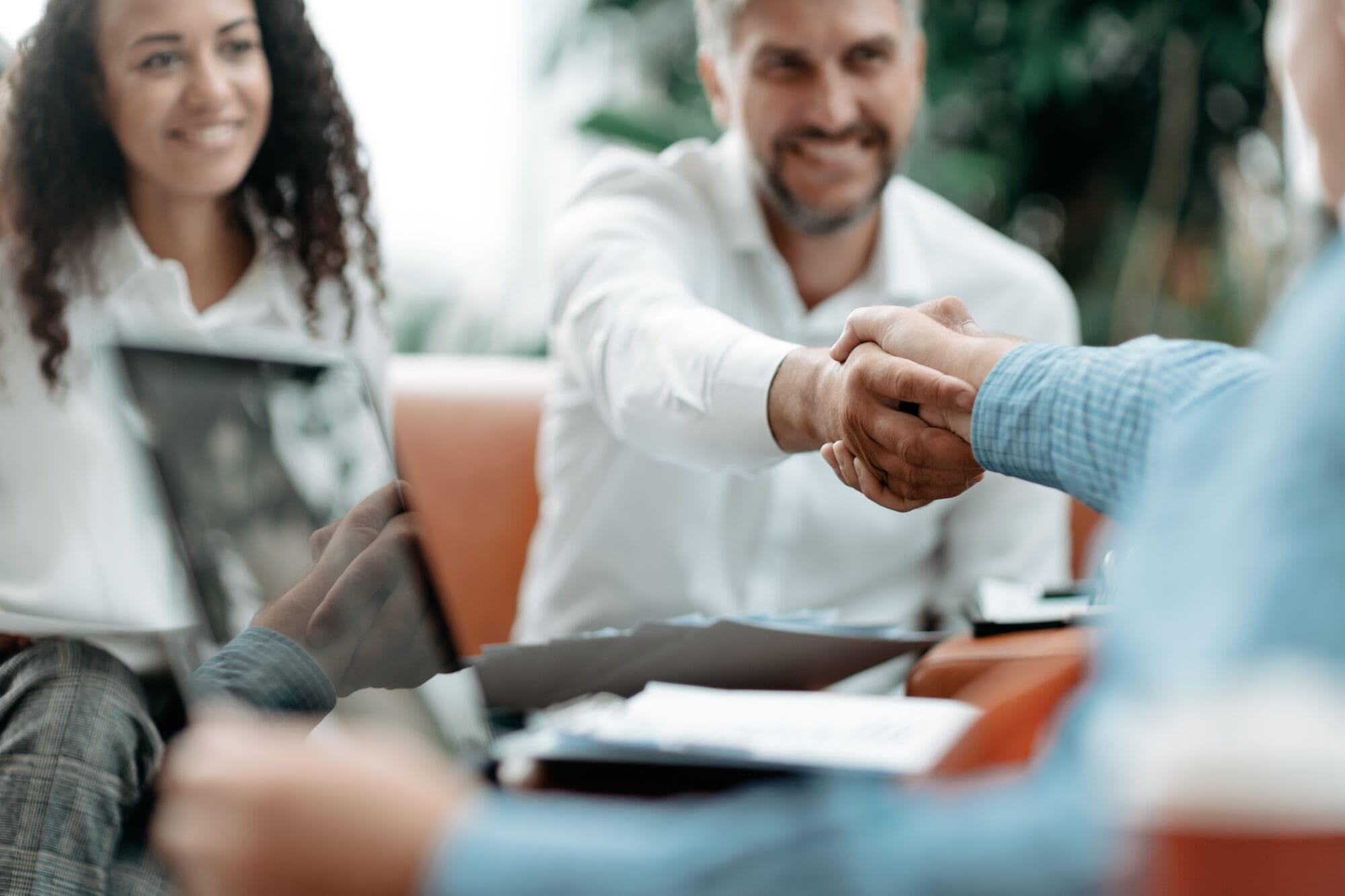 Smiling Businessman Shaking Hands With His Business Partner